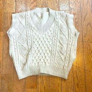 Sleeveless knit vest.